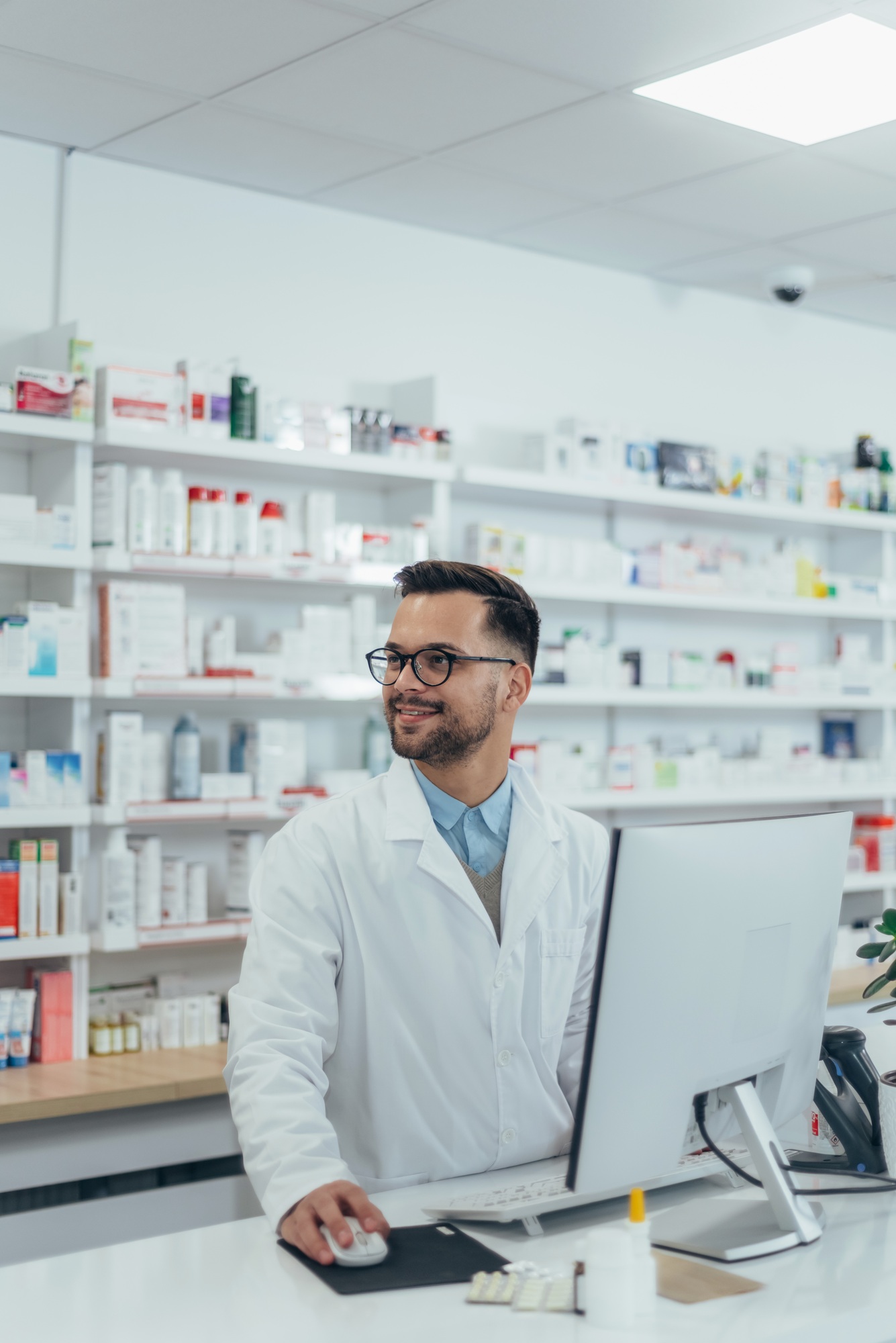 Portrait of a handsome pharmacist working in a pharmacy
